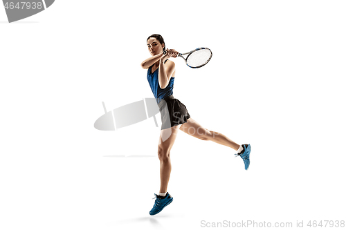 Image of Full length portrait of young woman playing tennis isolated on white background