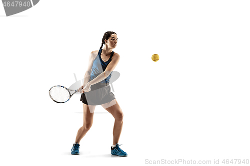 Image of Full length portrait of young woman playing tennis isolated on white background