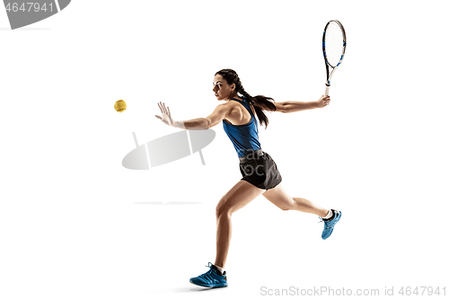 Image of Full length portrait of young woman playing tennis isolated on white background