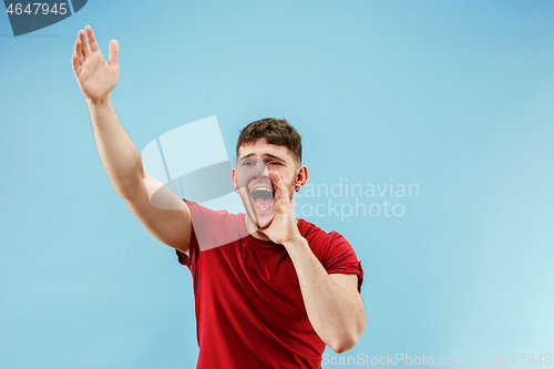 Image of Isolated on pink young casual man shouting at studio