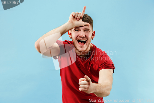 Image of Winning success man happy ecstatic celebrating being a winner. Dynamic energetic image of male model