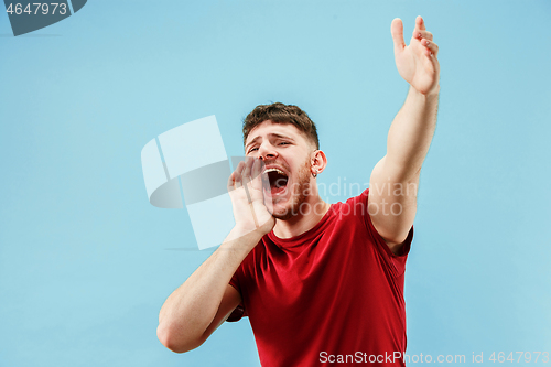 Image of Isolated on pink young casual man shouting at studio