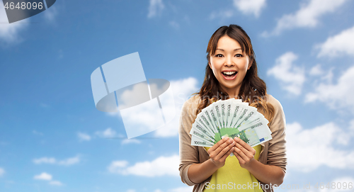 Image of asian woman with hundred euro money banknotes