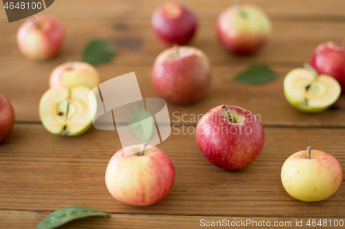 Image of ripe red apples on wooden table