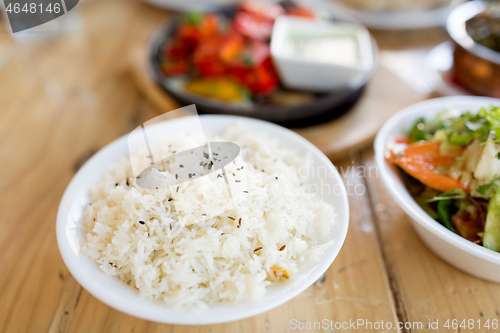 Image of close up of boiled rice in bowl on table