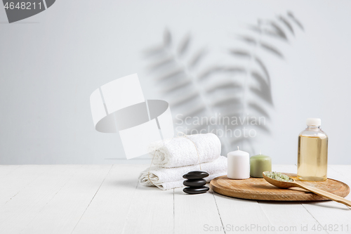 Image of Beautiful spa composition on massage table in wellness center, copyspace