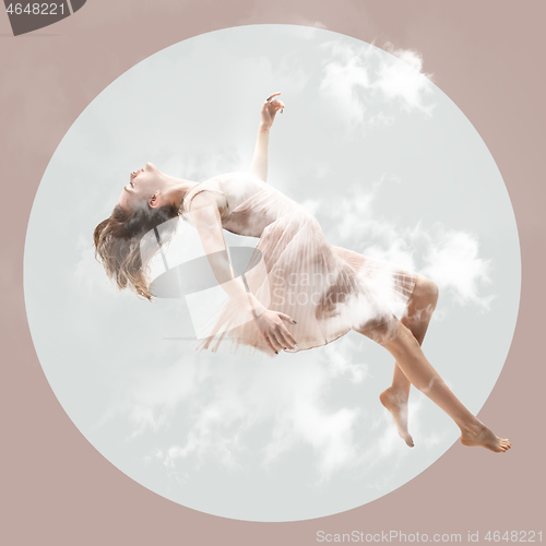 Image of Mid-air beauty. Full length studio shot of attractive young woman hovering in air and keeping eyes closed