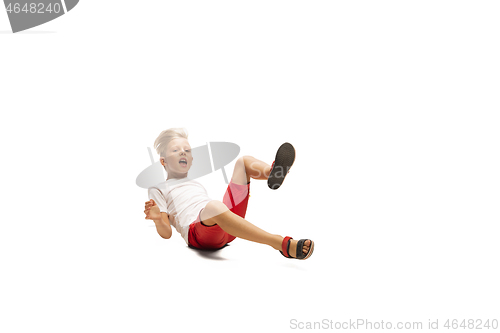 Image of Happy little caucasian boy jumping and running isolated on white background