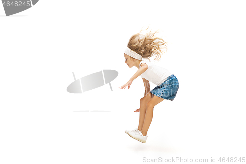 Image of Happy little caucasian girl jumping and running isolated on white background