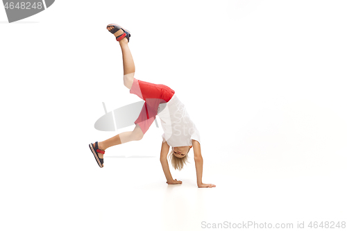 Image of Happy little caucasian boy jumping and running isolated on white background