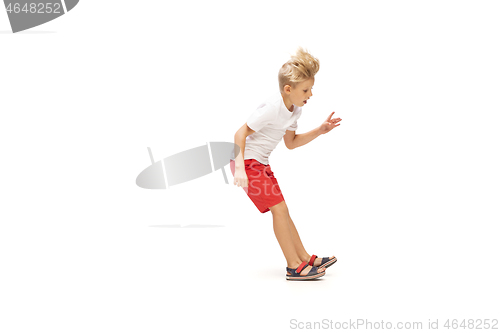 Image of Happy little caucasian boy jumping and running isolated on white background