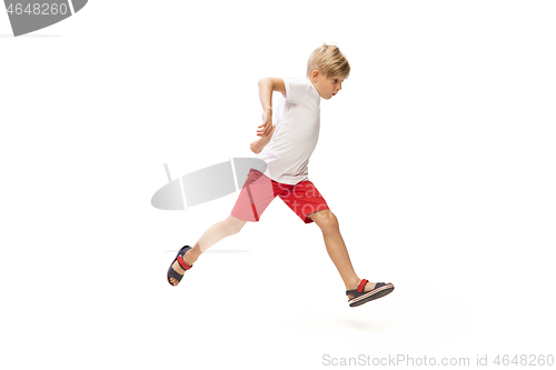 Image of Happy little caucasian boy jumping and running isolated on white background