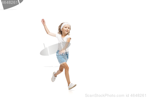 Image of Happy little caucasian girl jumping and running isolated on white background