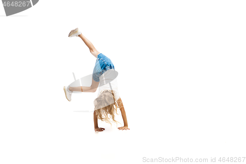 Image of Happy little caucasian girl jumping and running isolated on white background