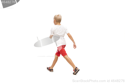 Image of Happy little caucasian boy jumping and running isolated on white background