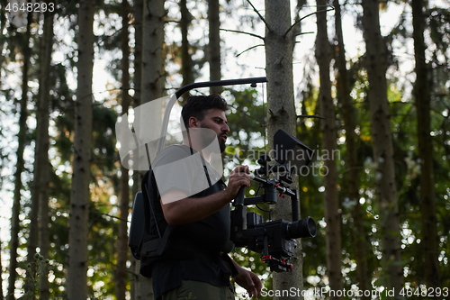 Image of Videographer Taking Action Shoot of Soldiers in Action