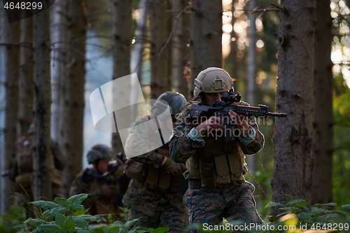 Image of Modern warfare Soldiers  Squad  in battle