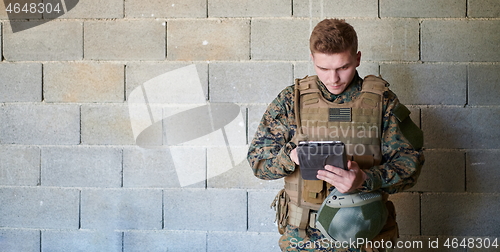 Image of soldier using tablet computer