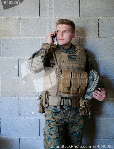 Image of soldier using smartphone