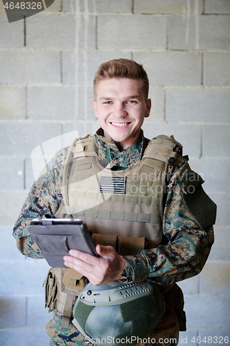 Image of soldier using tablet computer