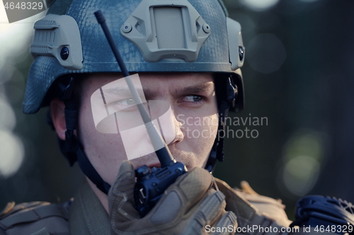 Image of Officer Talking Portable Radio Station