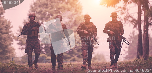 Image of soldiers squad relaxed walking