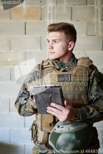 Image of soldier using tablet computer