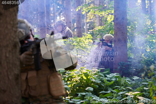 Image of Modern warfare Soldiers  Squad  in battle