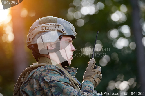 Image of Officer Talking Portable Radio Station