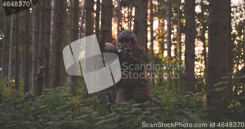 Image of officer is  showing tactical hand signals