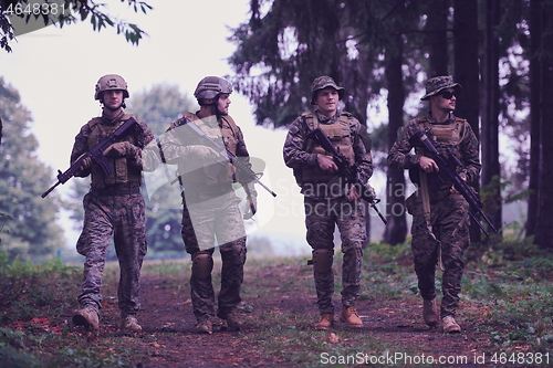 Image of soldiers squad relaxed walking