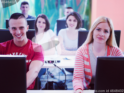 Image of technology students group in computer lab school  classroom