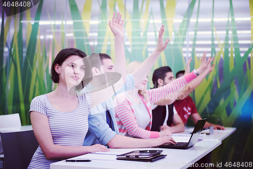 Image of students group raise hands up