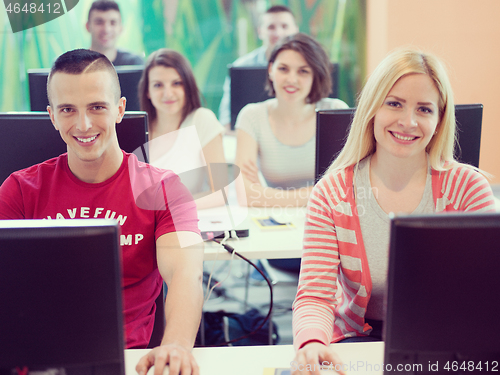 Image of technology students group in computer lab school  classroom