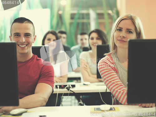 Image of technology students group in computer lab school  classroom