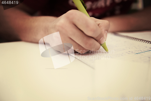 Image of student hand underlining a document