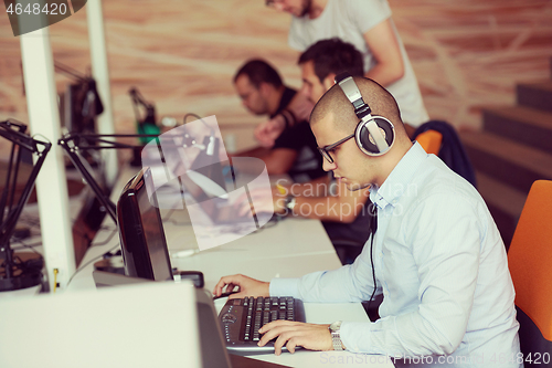 Image of startup business, software developer working on computer