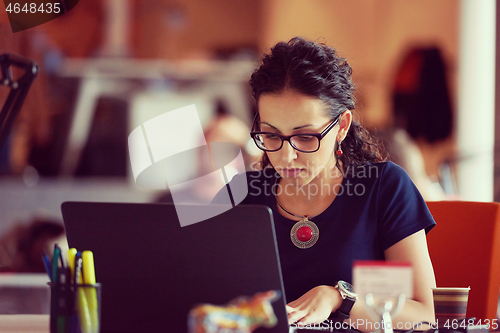 Image of startup business, woman  working on laptop