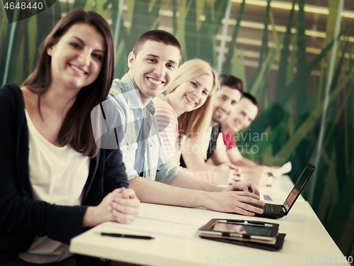 Image of group of students study together in classroom