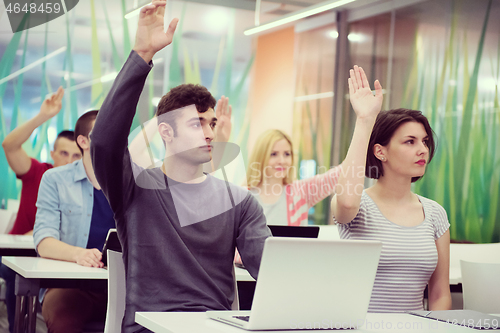 Image of students group raise hands up