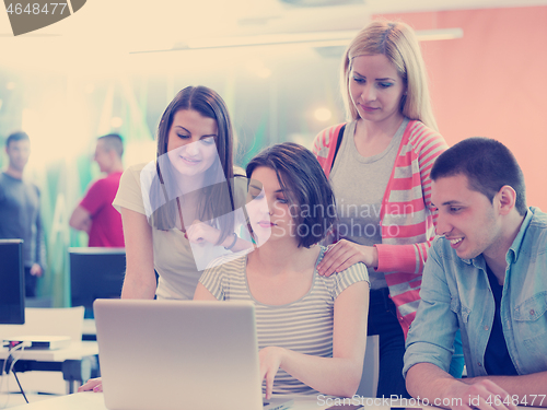 Image of group of students study together in classroom