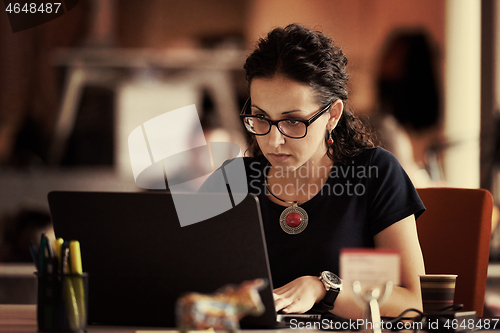 Image of startup business, woman  working on laptop