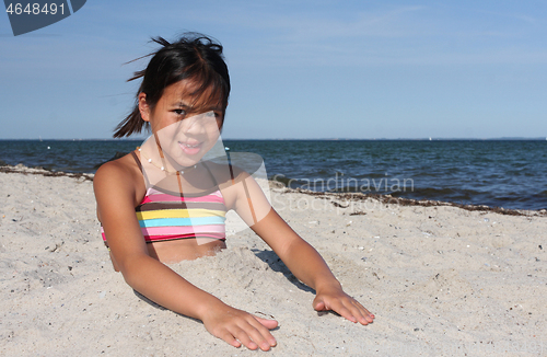 Image of Cute girl at the beach in the summer