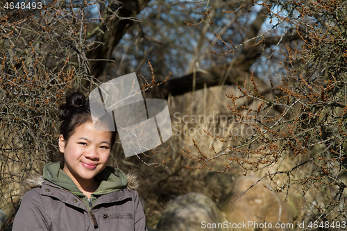 Image of Portrait of a young cute girl looking at the camera