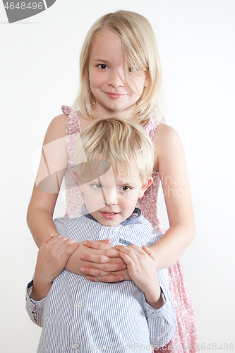 Image of Portrait of a brother and sister in studio