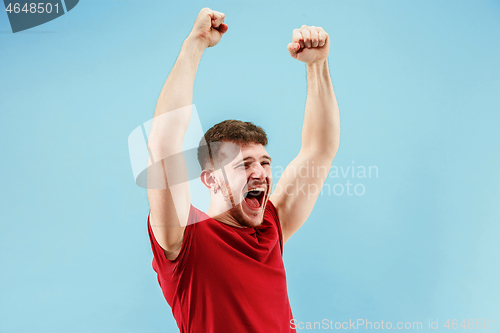 Image of Winning success man happy ecstatic celebrating being a winner. Dynamic energetic image of male model