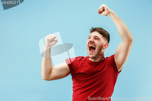 Image of Winning success man happy ecstatic celebrating being a winner. Dynamic energetic image of male model