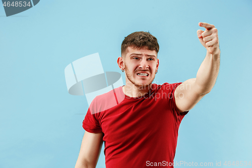 Image of Young boy with a surprised expression bet slip on blue background