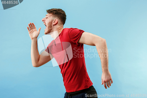 Image of Isolated on pink young casual man shouting at studio