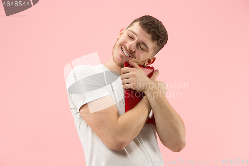 Image of Businessman hugging laptop